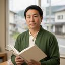 編集担当のKa 生駒が筑豊の取材ノートを持つ姿